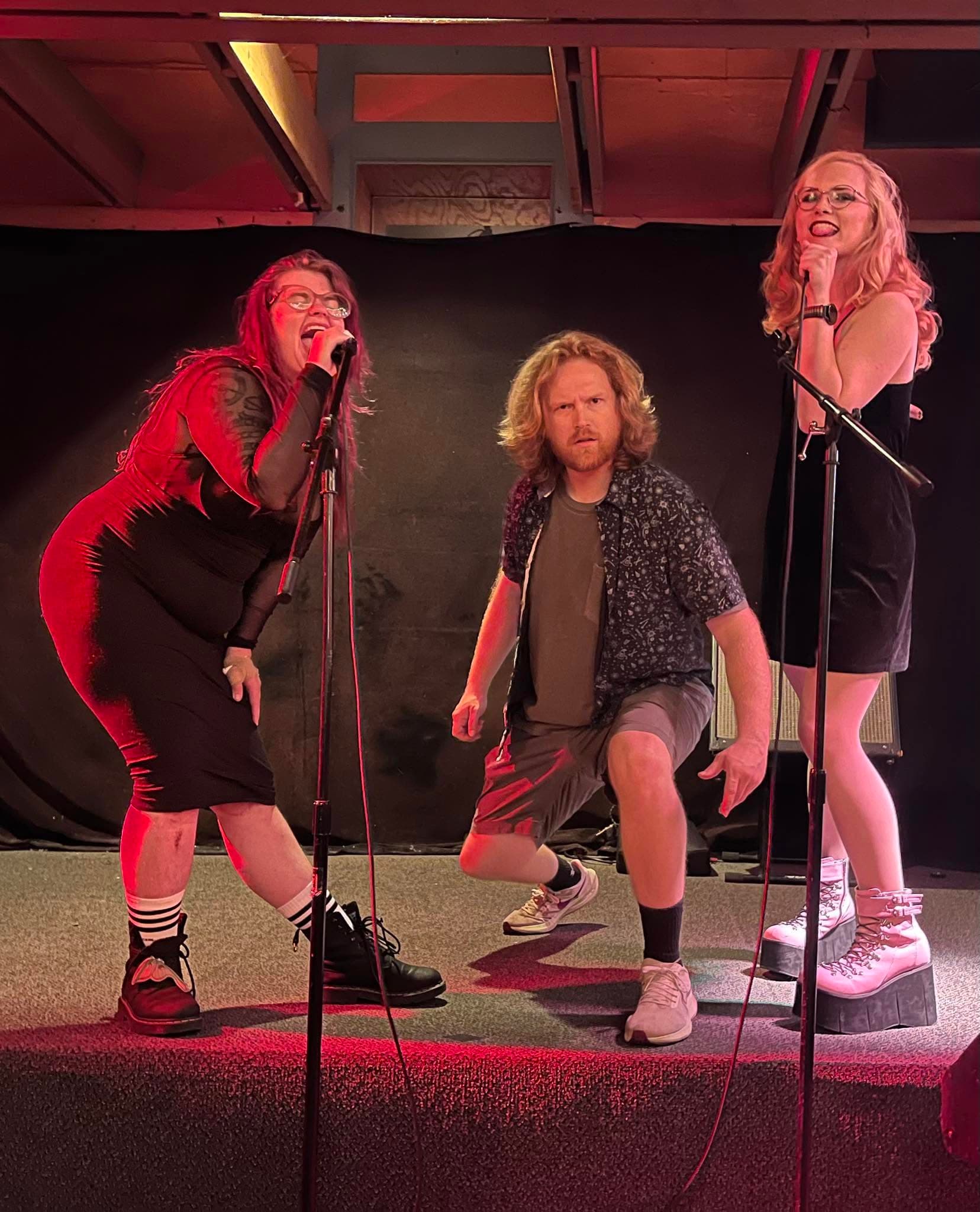 Three of Ypsi's Finest DJs singing on stage